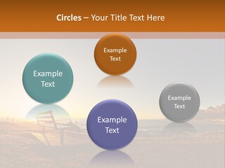 A Bench Sitting On Top Of A Sandy Beach PowerPoint Template