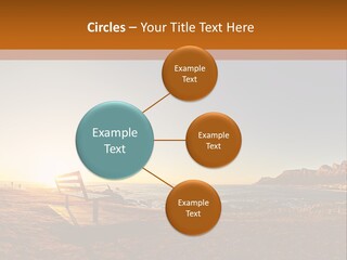 A Bench Sitting On Top Of A Sandy Beach PowerPoint Template