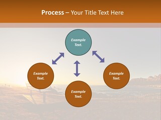 A Bench Sitting On Top Of A Sandy Beach PowerPoint Template