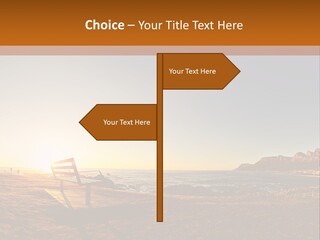 A Bench Sitting On Top Of A Sandy Beach PowerPoint Template