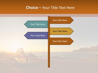 A Bench Sitting On Top Of A Sandy Beach PowerPoint Template