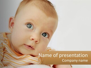 A Baby With Blue Eyes Is Looking At The Camera PowerPoint Template