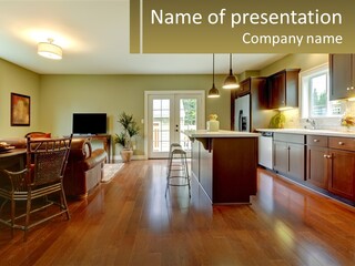 A Living Room And Kitchen With A Table And Chairs PowerPoint Template