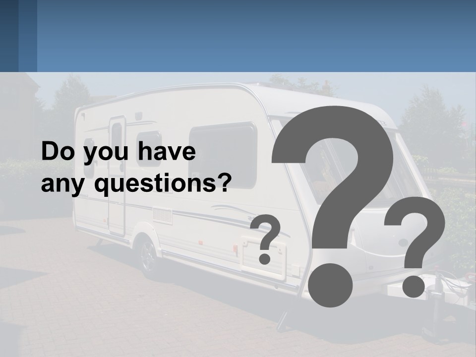 A White Motor Home Parked In A Driveway PowerPoint Template