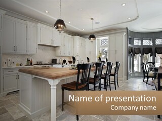 A Large Kitchen With A Table And Chairs PowerPoint Template