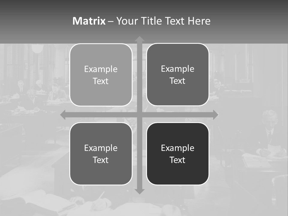 A Group Of People Sitting At Desks In A Room PowerPoint Template