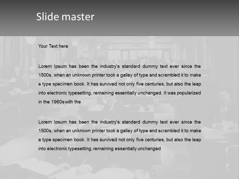 A Group Of People Sitting At Desks In A Room PowerPoint Template