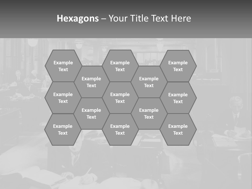 A Group Of People Sitting At Desks In A Room PowerPoint Template