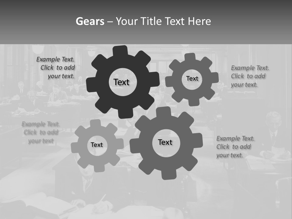 A Group Of People Sitting At Desks In A Room PowerPoint Template