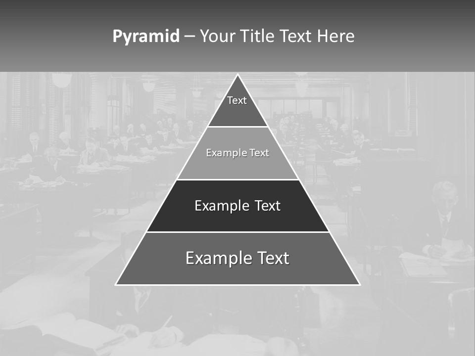 A Group Of People Sitting At Desks In A Room PowerPoint Template