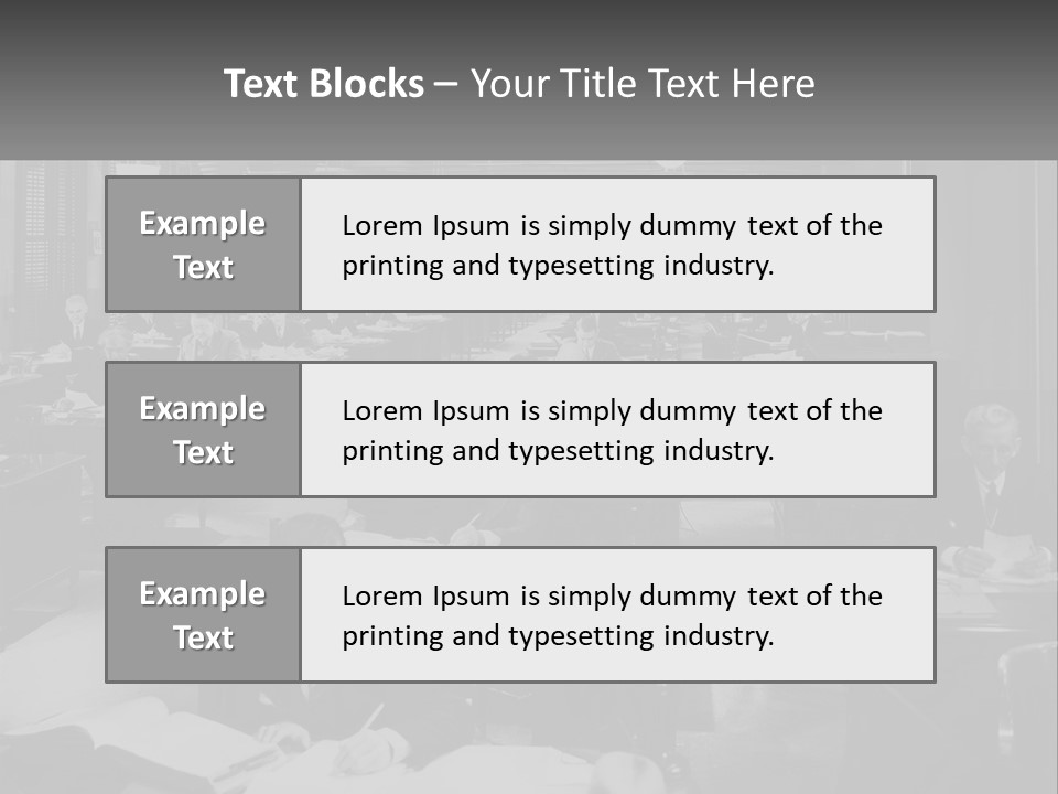 A Group Of People Sitting At Desks In A Room PowerPoint Template