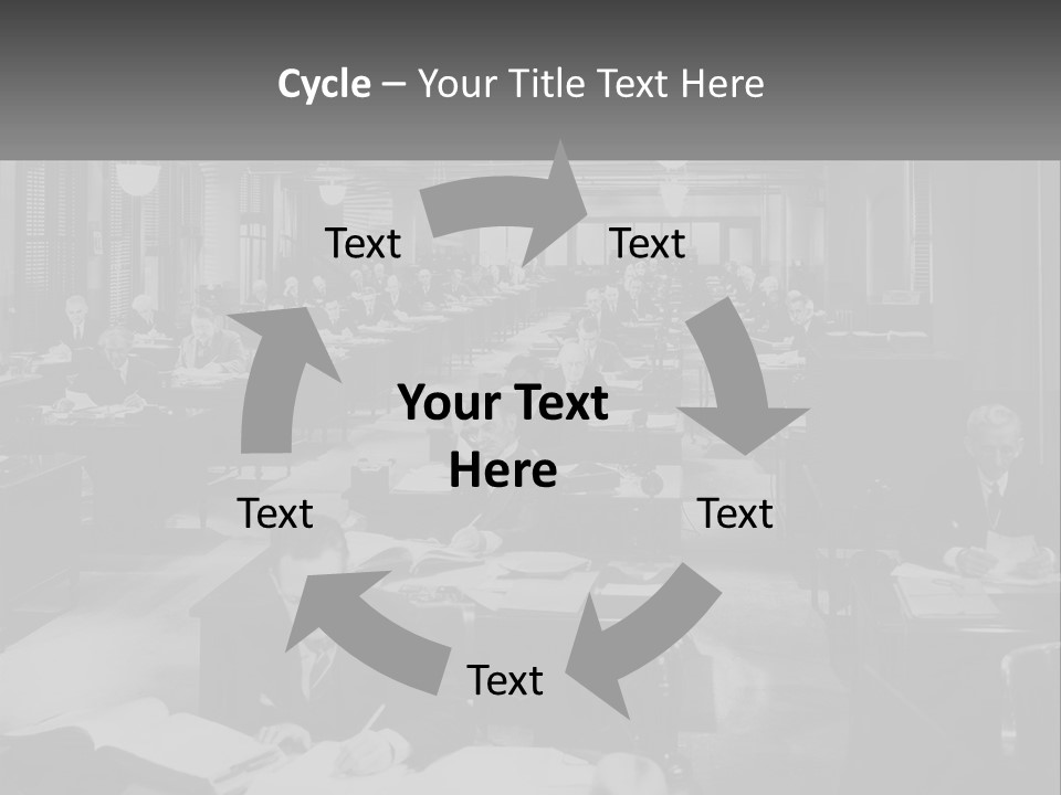 A Group Of People Sitting At Desks In A Room PowerPoint Template