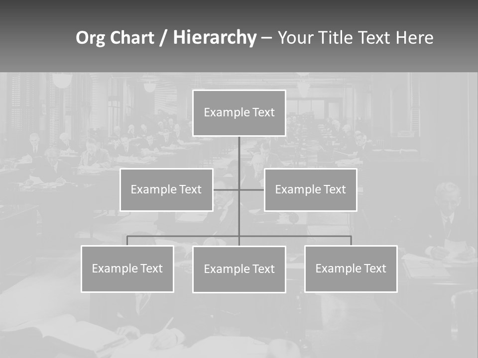 A Group Of People Sitting At Desks In A Room PowerPoint Template