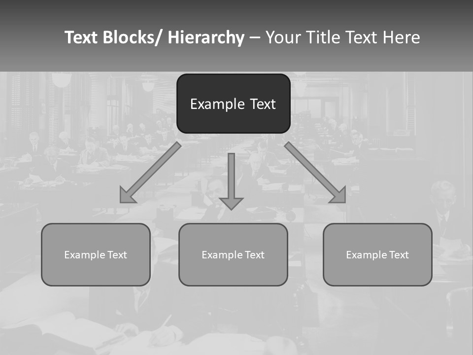 A Group Of People Sitting At Desks In A Room PowerPoint Template