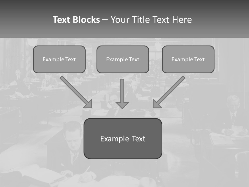 A Group Of People Sitting At Desks In A Room PowerPoint Template