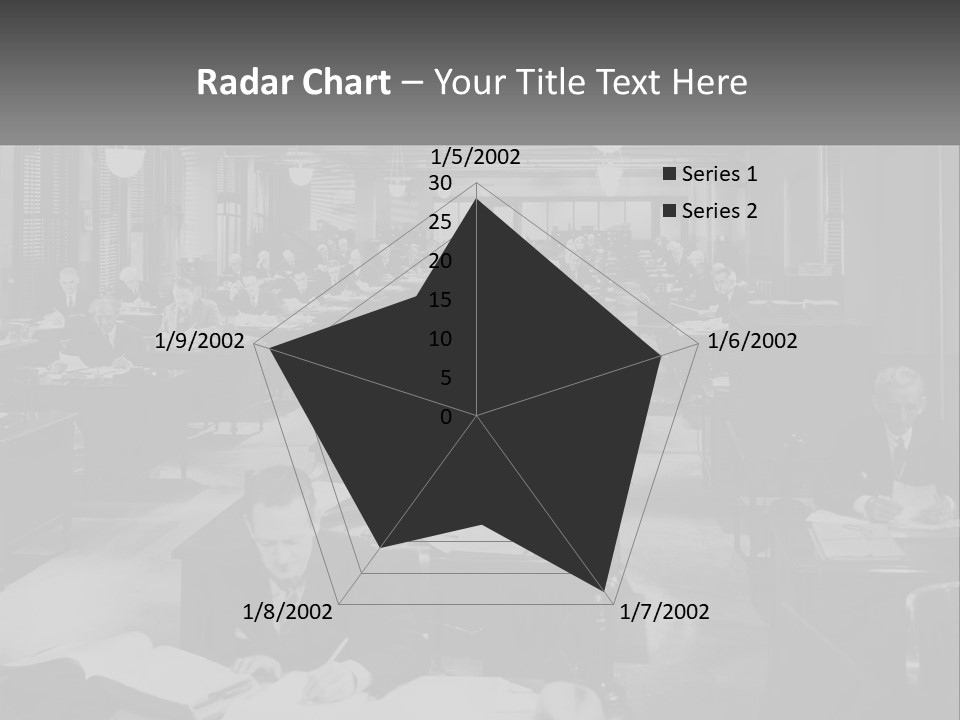 A Group Of People Sitting At Desks In A Room PowerPoint Template