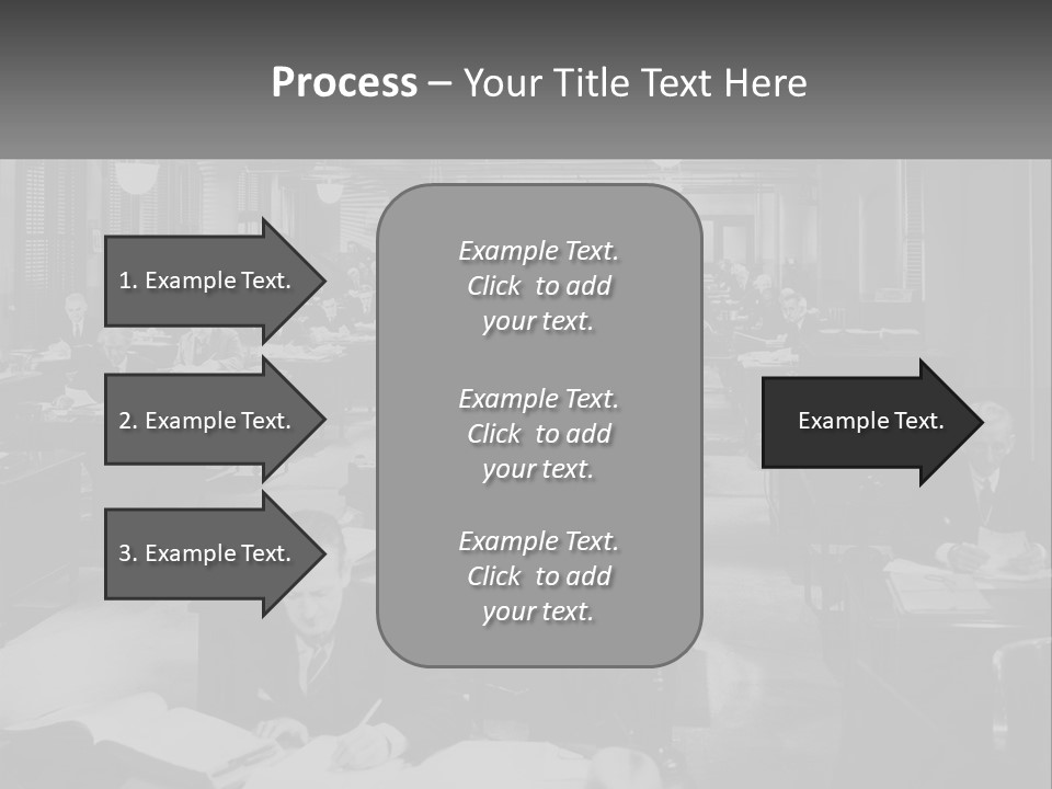 A Group Of People Sitting At Desks In A Room PowerPoint Template