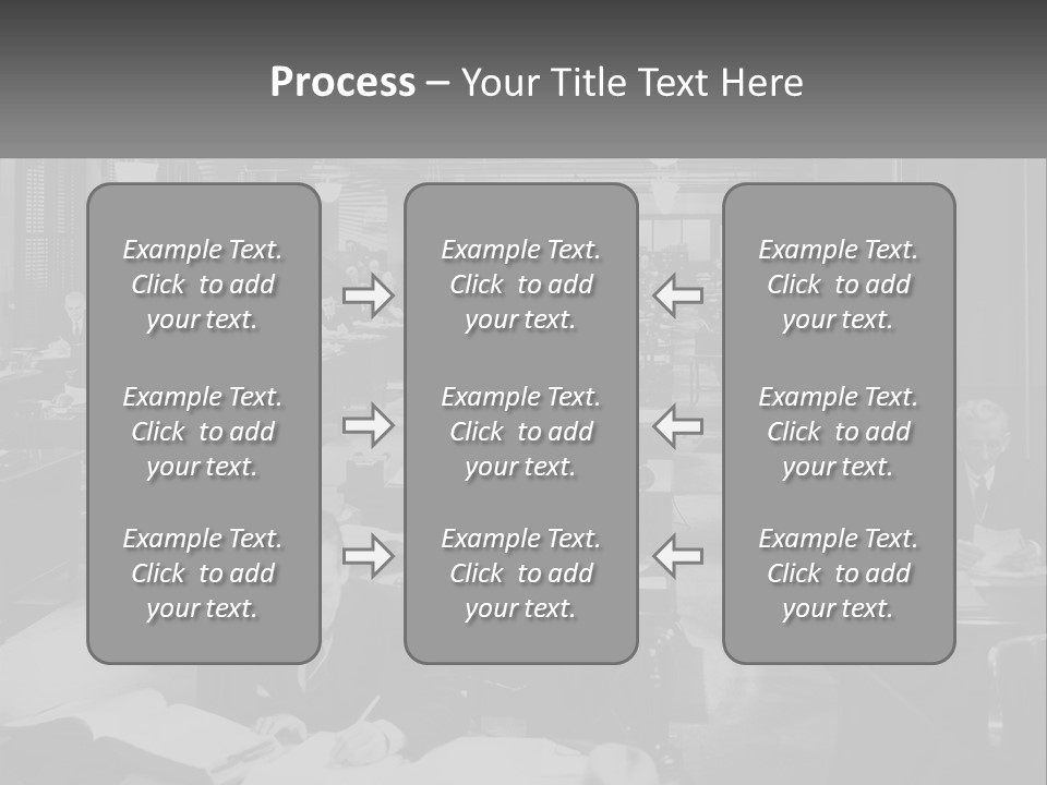A Group Of People Sitting At Desks In A Room PowerPoint Template