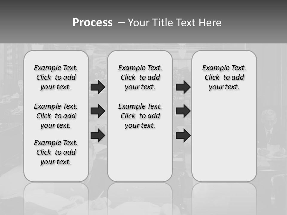 A Group Of People Sitting At Desks In A Room PowerPoint Template
