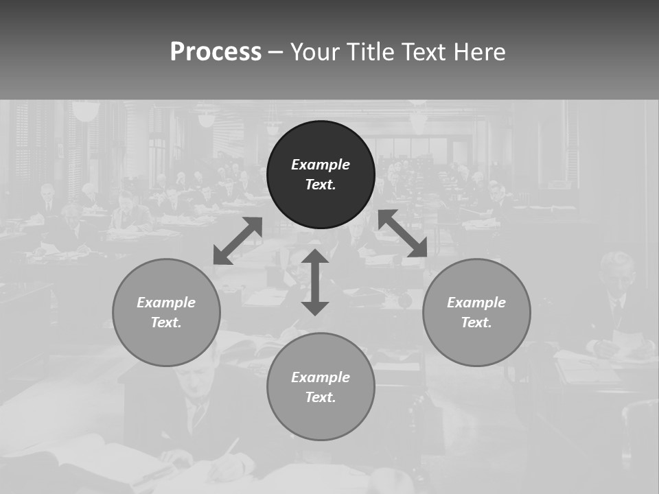 A Group Of People Sitting At Desks In A Room PowerPoint Template