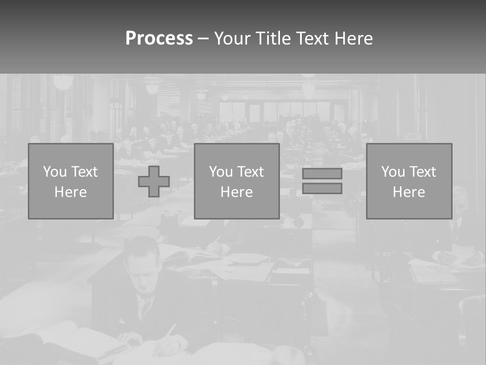 A Group Of People Sitting At Desks In A Room PowerPoint Template