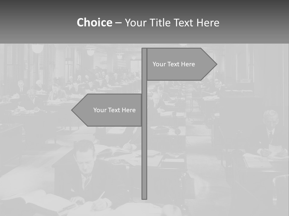 A Group Of People Sitting At Desks In A Room PowerPoint Template