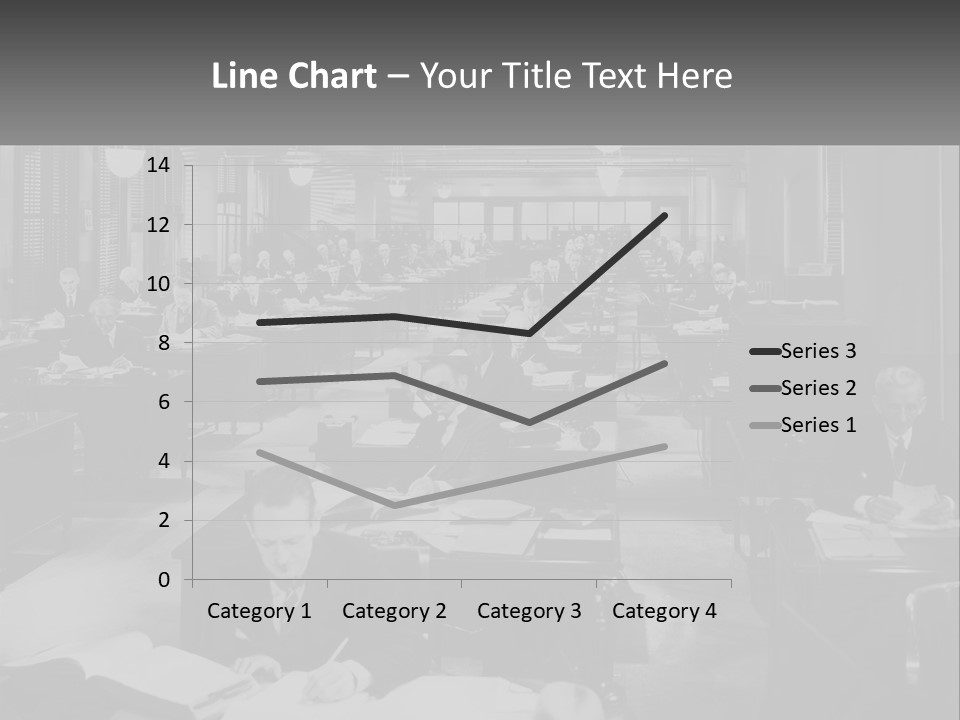 A Group Of People Sitting At Desks In A Room PowerPoint Template