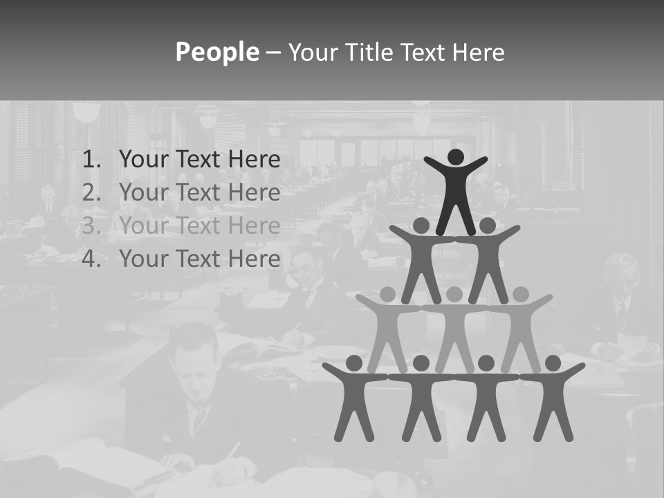 A Group Of People Sitting At Desks In A Room PowerPoint Template