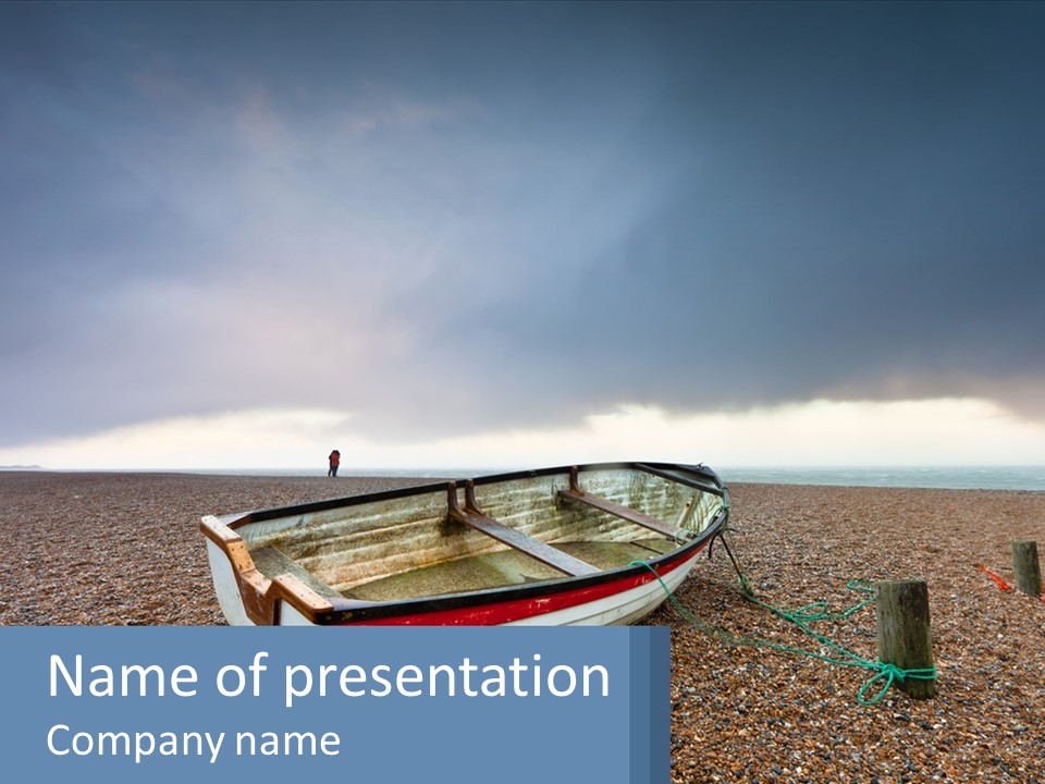 A Boat Sitting On Top Of A Sandy Beach PowerPoint Template