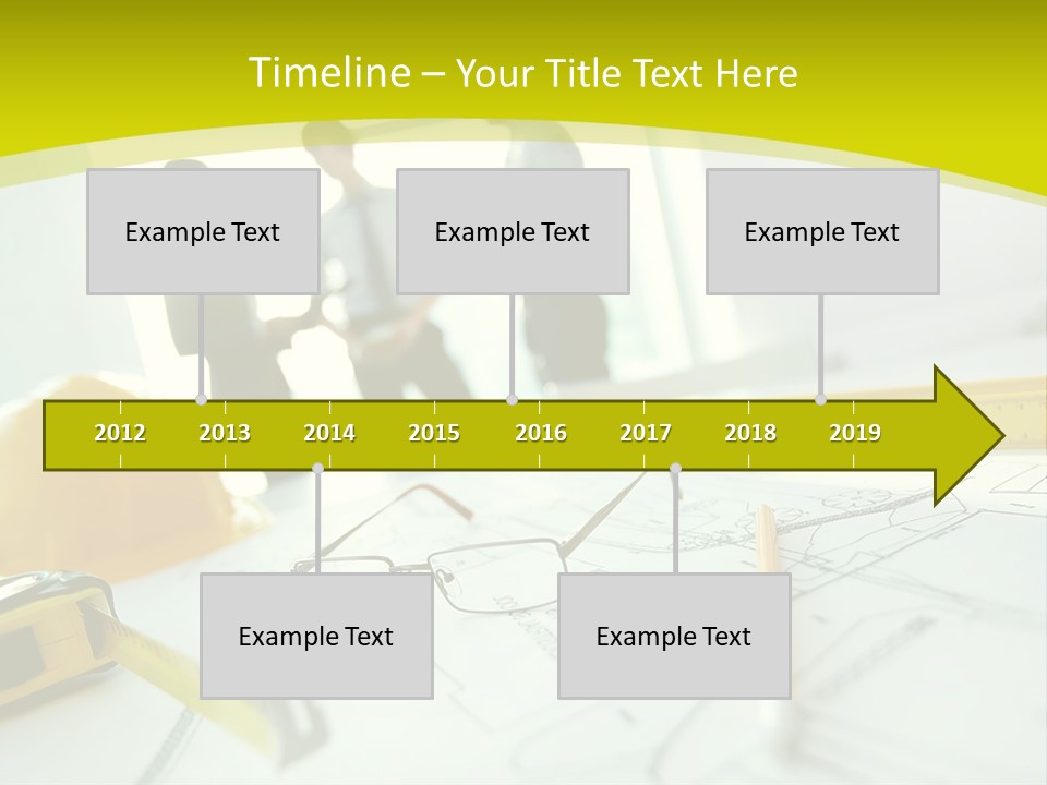 A Group Of People Standing Around A Table With Blueprint PowerPoint Template