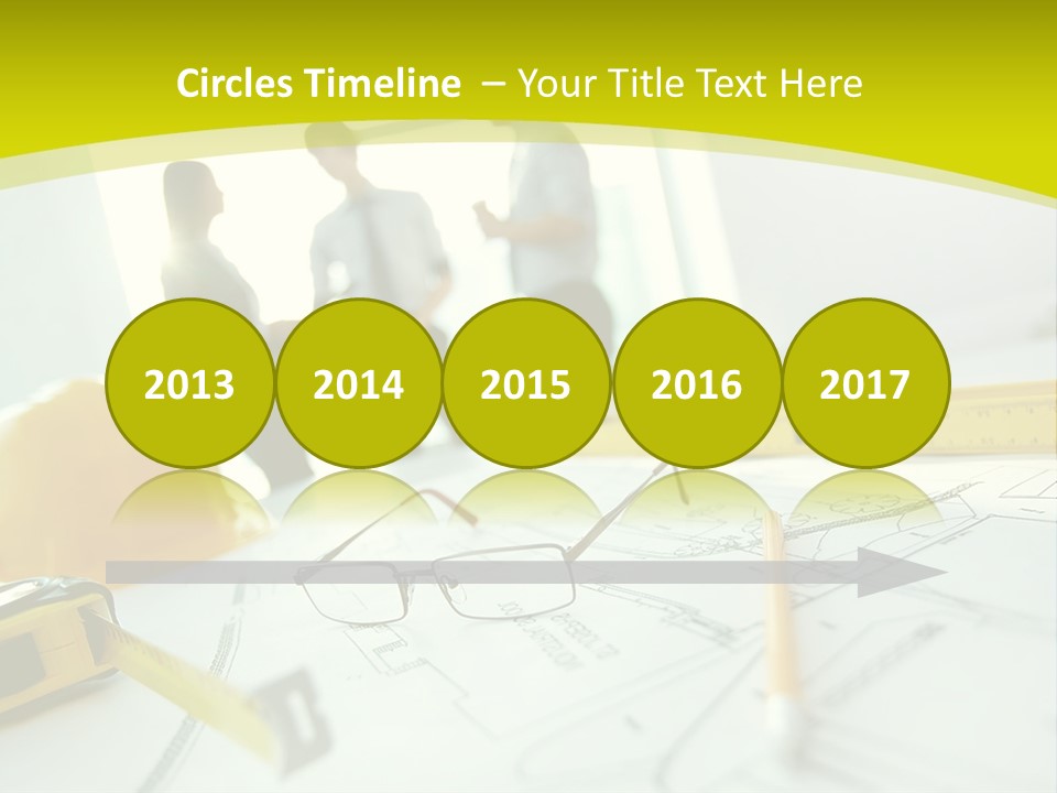 A Group Of People Standing Around A Table With Blueprint PowerPoint Template