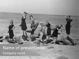 A Group Of Women Standing On Top Of A Beach PowerPoint Template