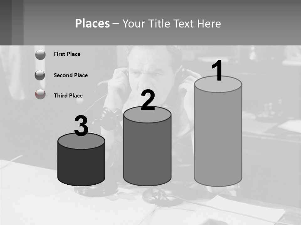 A Man Sitting At A Desk Talking On A Phone PowerPoint Template