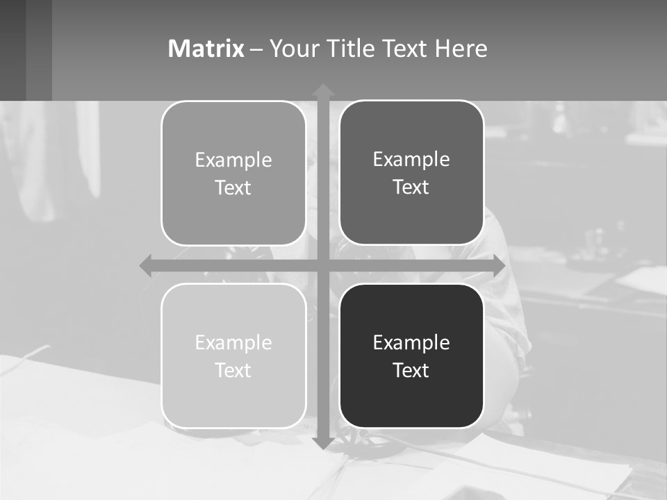 A Man Sitting At A Desk Talking On A Phone PowerPoint Template