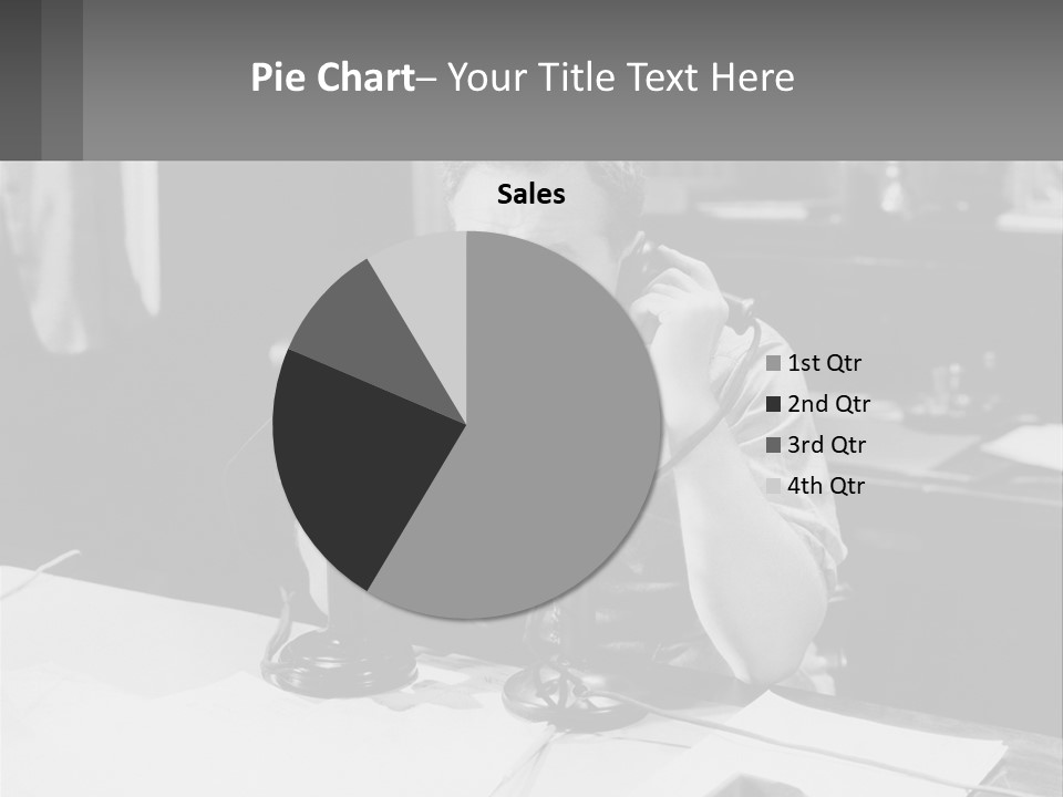 A Man Sitting At A Desk Talking On A Phone PowerPoint Template