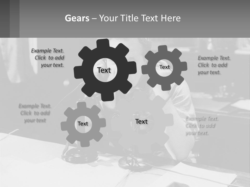 A Man Sitting At A Desk Talking On A Phone PowerPoint Template