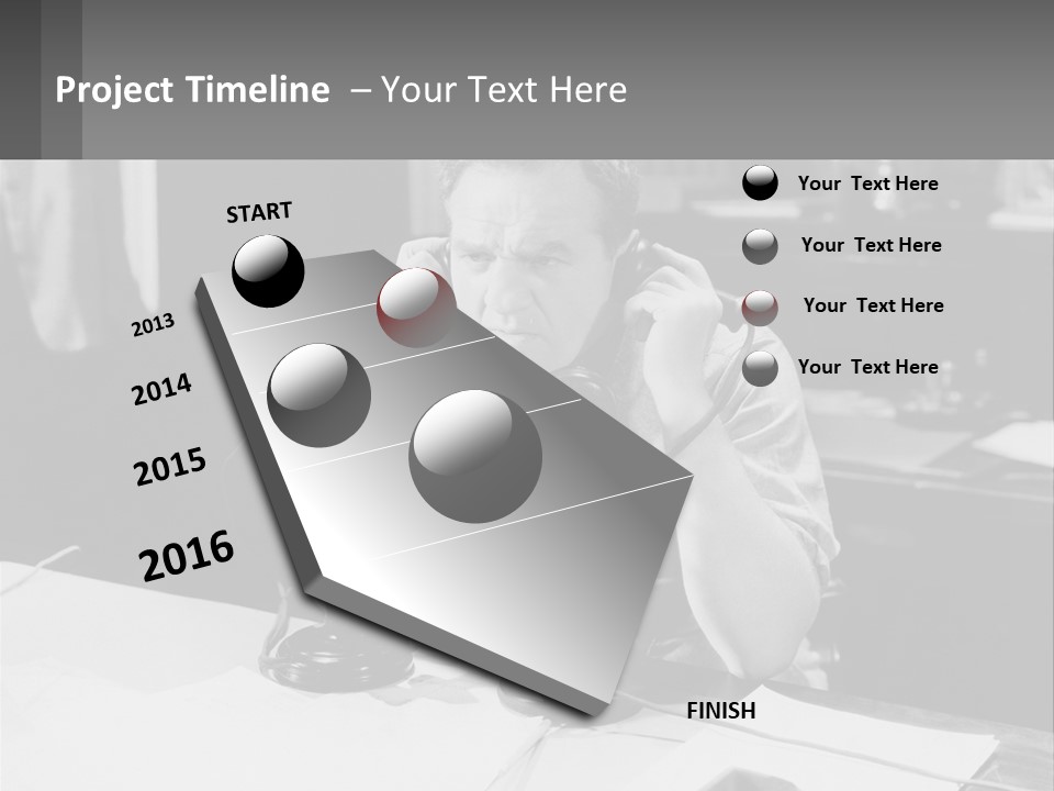 A Man Sitting At A Desk Talking On A Phone PowerPoint Template