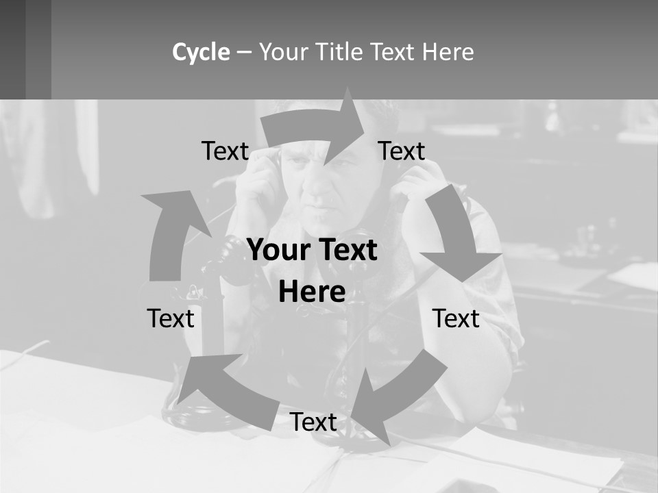 A Man Sitting At A Desk Talking On A Phone PowerPoint Template