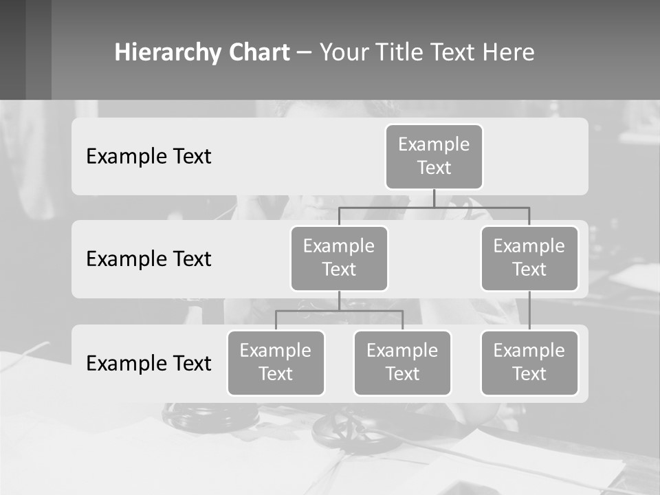A Man Sitting At A Desk Talking On A Phone PowerPoint Template
