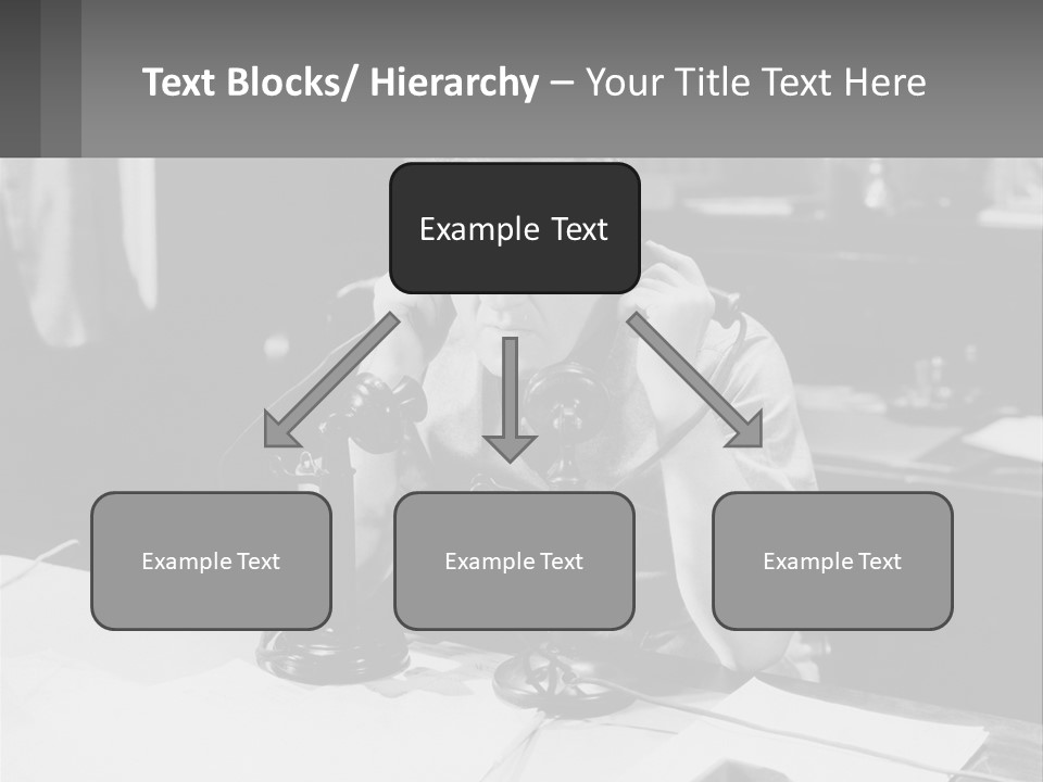 A Man Sitting At A Desk Talking On A Phone PowerPoint Template