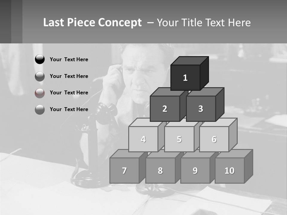 A Man Sitting At A Desk Talking On A Phone PowerPoint Template
