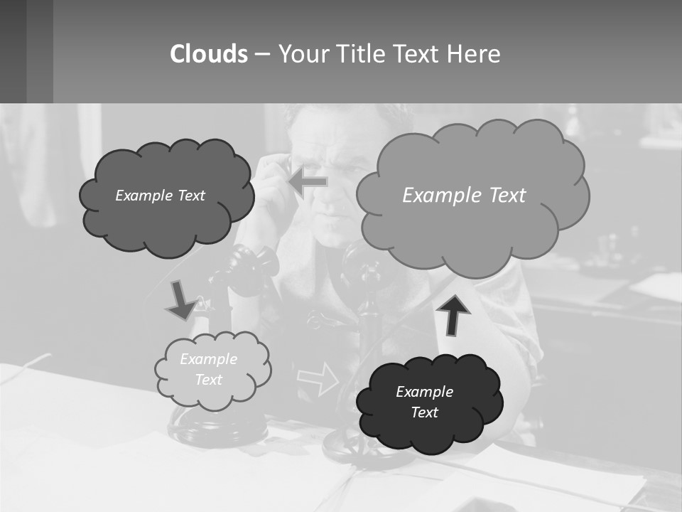 A Man Sitting At A Desk Talking On A Phone PowerPoint Template