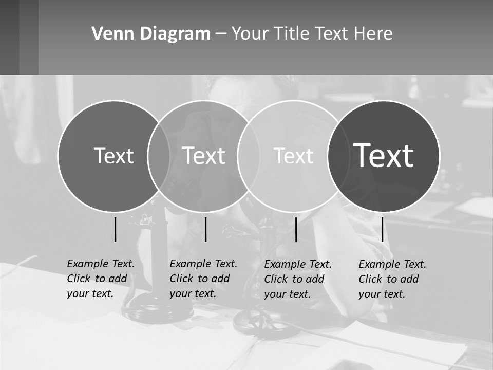A Man Sitting At A Desk Talking On A Phone PowerPoint Template