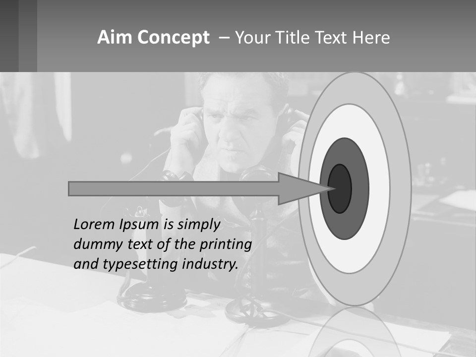 A Man Sitting At A Desk Talking On A Phone PowerPoint Template