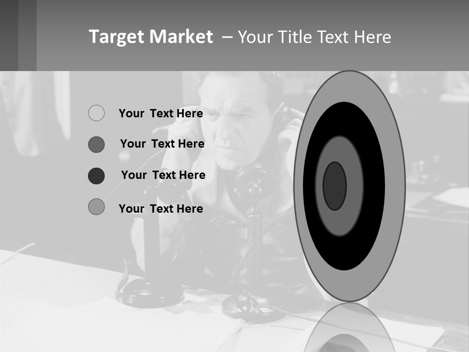 A Man Sitting At A Desk Talking On A Phone PowerPoint Template