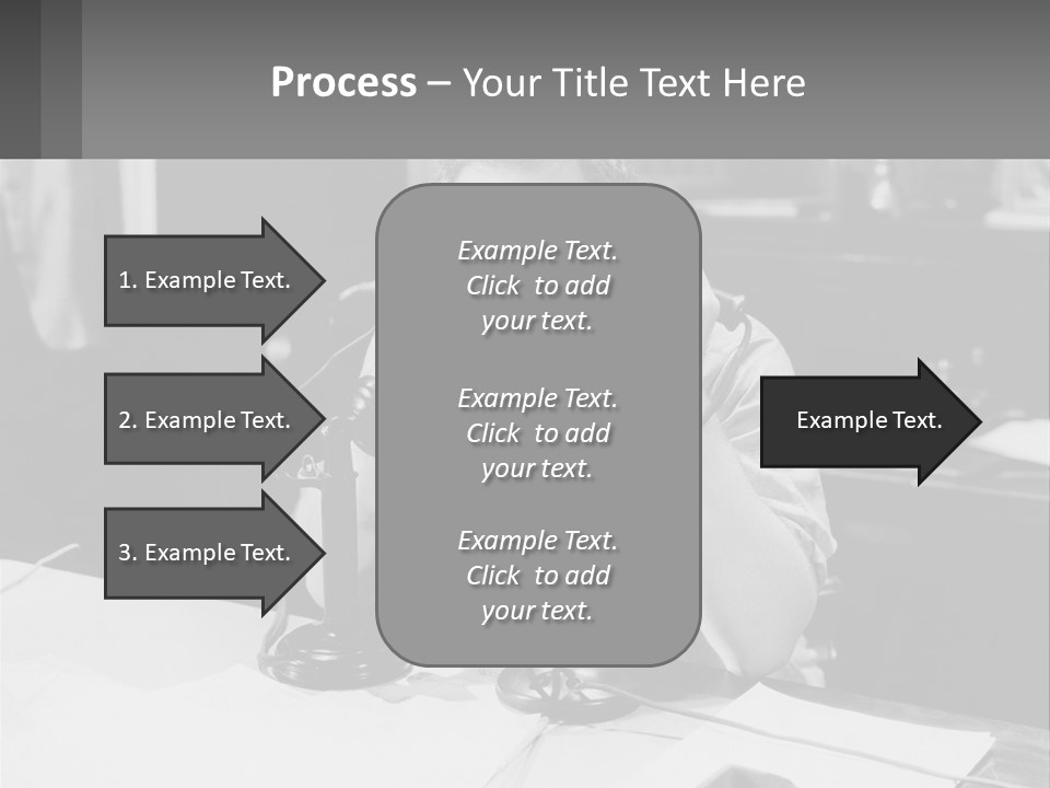 A Man Sitting At A Desk Talking On A Phone PowerPoint Template