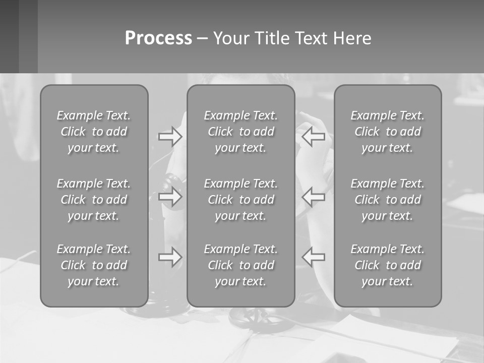 A Man Sitting At A Desk Talking On A Phone PowerPoint Template