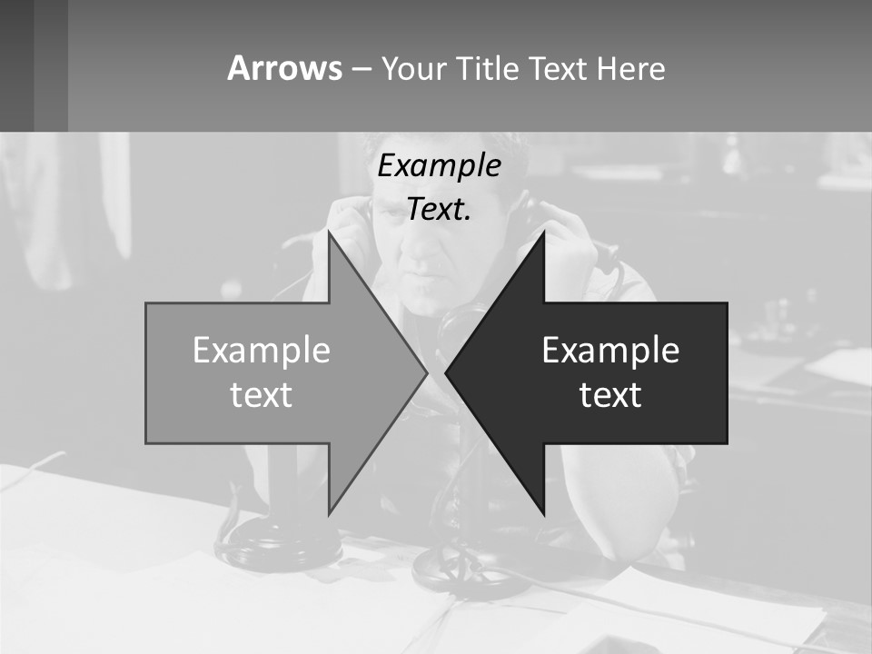 A Man Sitting At A Desk Talking On A Phone PowerPoint Template