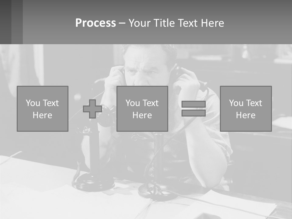 A Man Sitting At A Desk Talking On A Phone PowerPoint Template