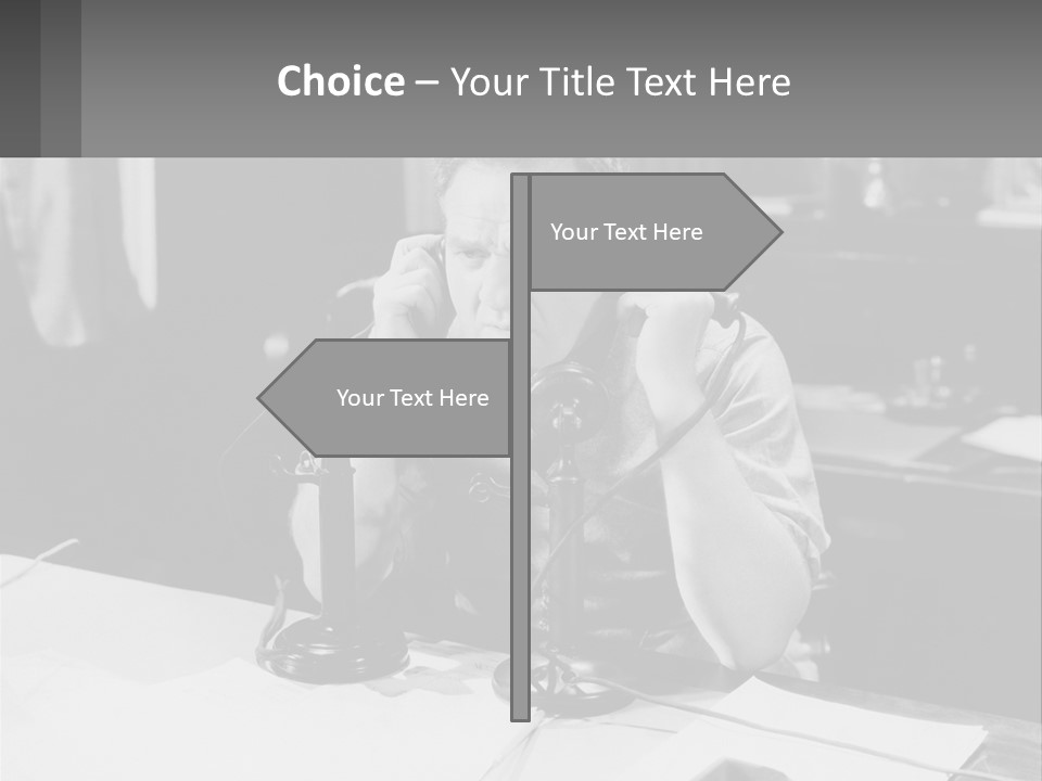 A Man Sitting At A Desk Talking On A Phone PowerPoint Template